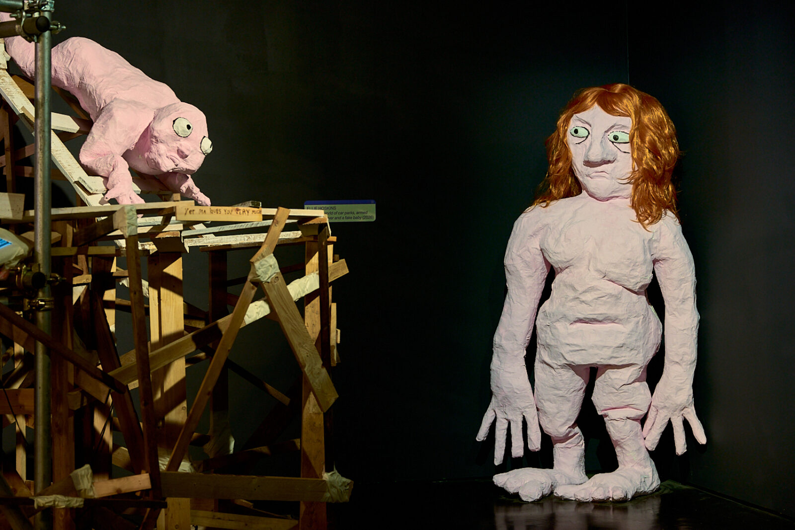 Ellie Hoskins, Alive in a world of car parks, armed with an air fryer and a fake baby (2026). Installation view as part of group exhibition BRB at FACT Liverpool. Photography by Rob Battersby.